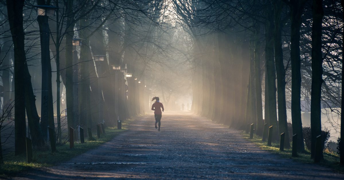 Woman on a run through the woods